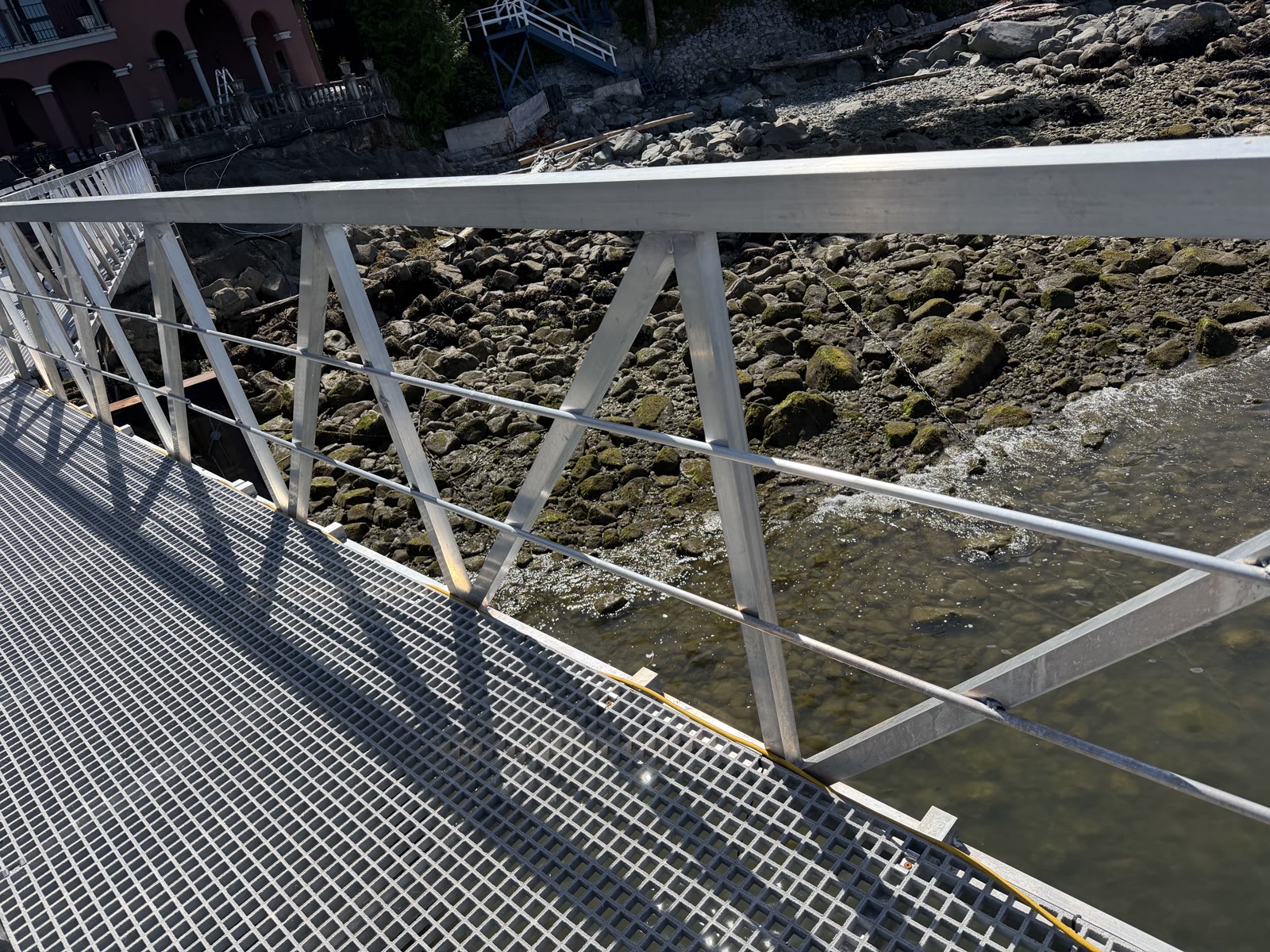 Aluminum gangway railing and bracing along the shoreline
