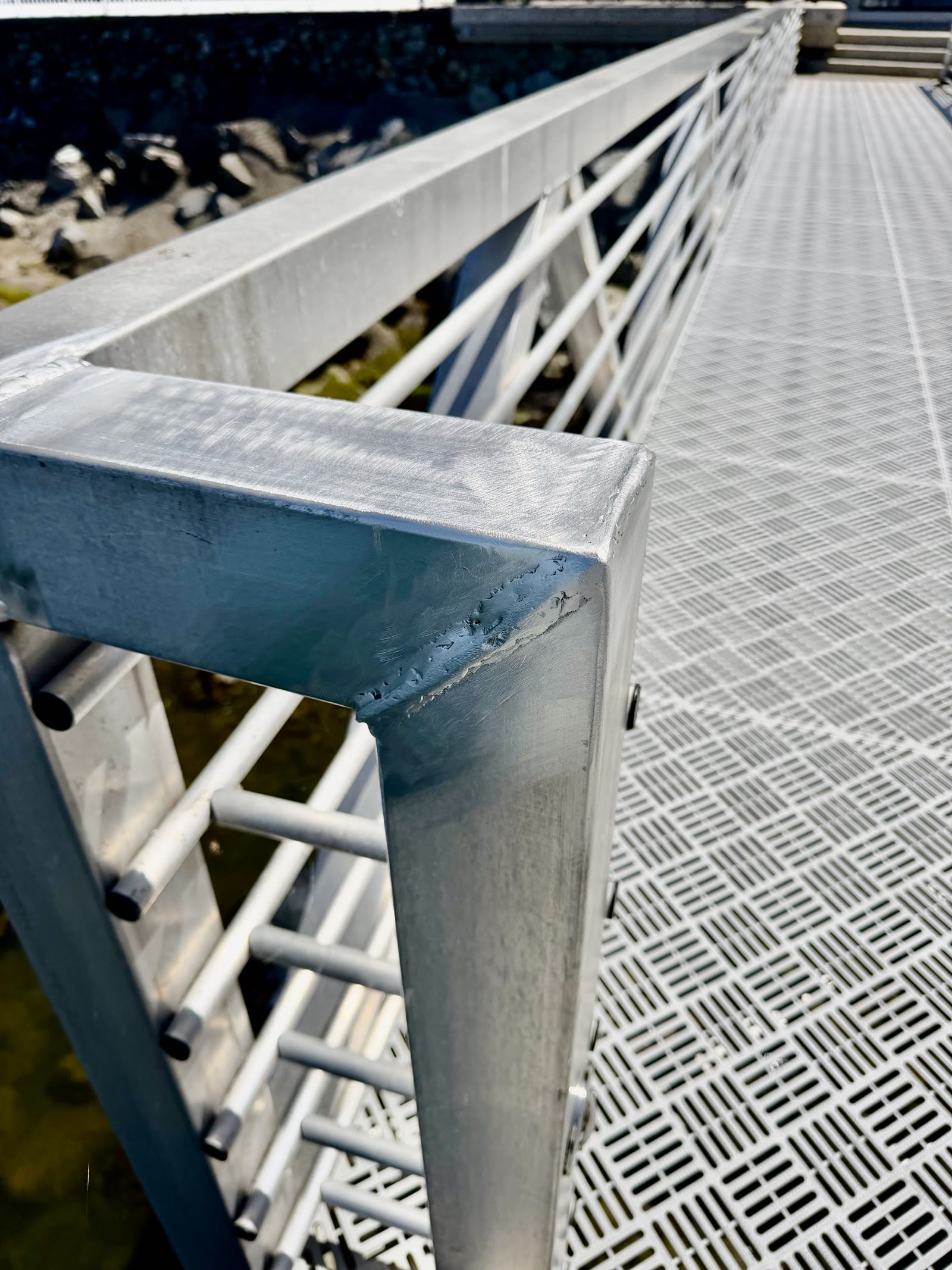 Repaired aluminum dock railing corner after welding